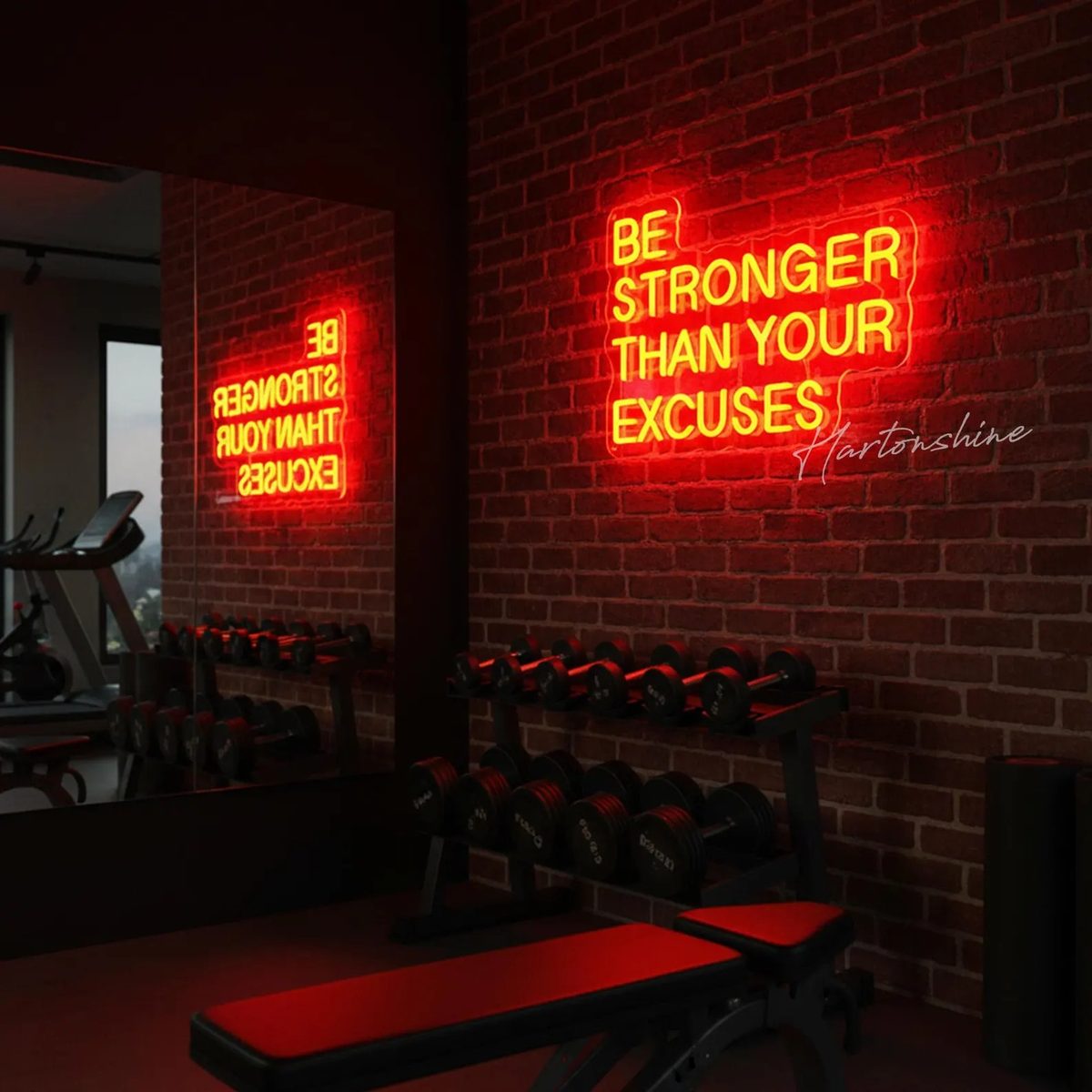Неоновая надпись Be Stronger Than Your Excuses красным неоном в зале с гантелями